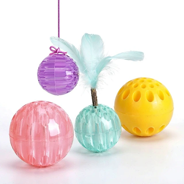 Studio packshot of a set of four textured cat balls with feather wands - cat balls set of four ribbed plastic toy balls with feather wands - cat balls wholesale supplier