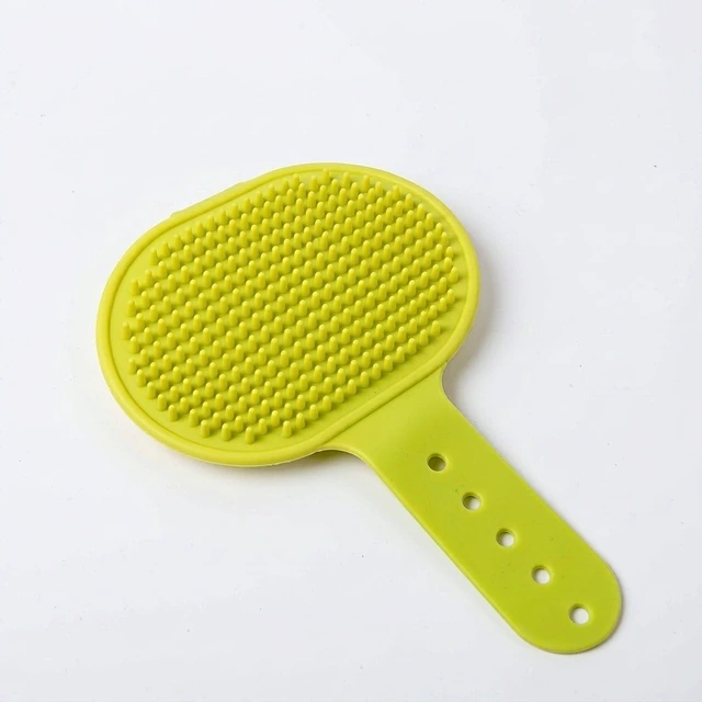 Studio packshot of a silicone dog grooming brush with adjustable strap - silicone dog grooming and bath brush with adjustable strap - dog brush wholesale supplier