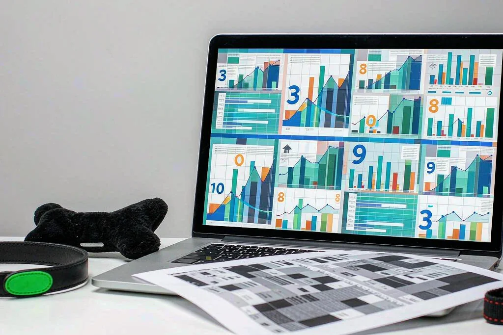 Laptop showing pet product trend charts for Amazon and TikTok Shop sellers