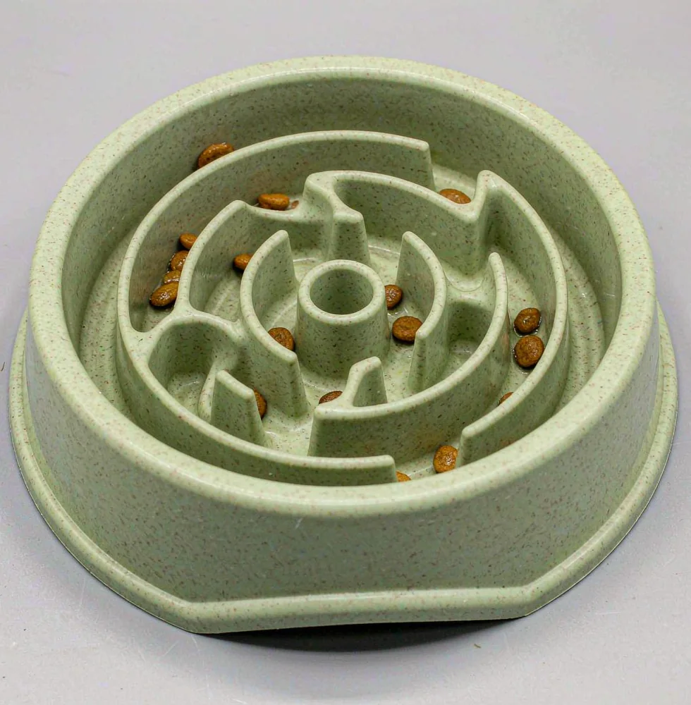 Slow feeder puzzle bowl with a molded maze pattern for dogs and cats