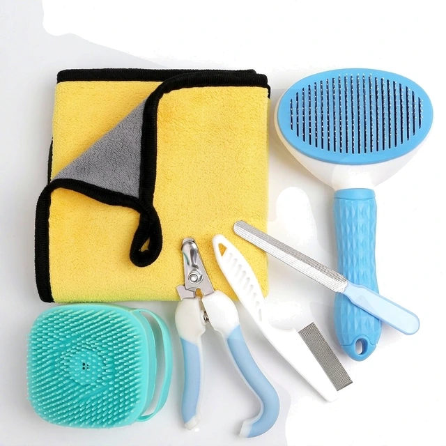 Studio packshot of a five piece dog grooming and bath kit - five piece dog grooming and bath kit with towel brush comb and clippers - dog grooming supplies wholesale supplier